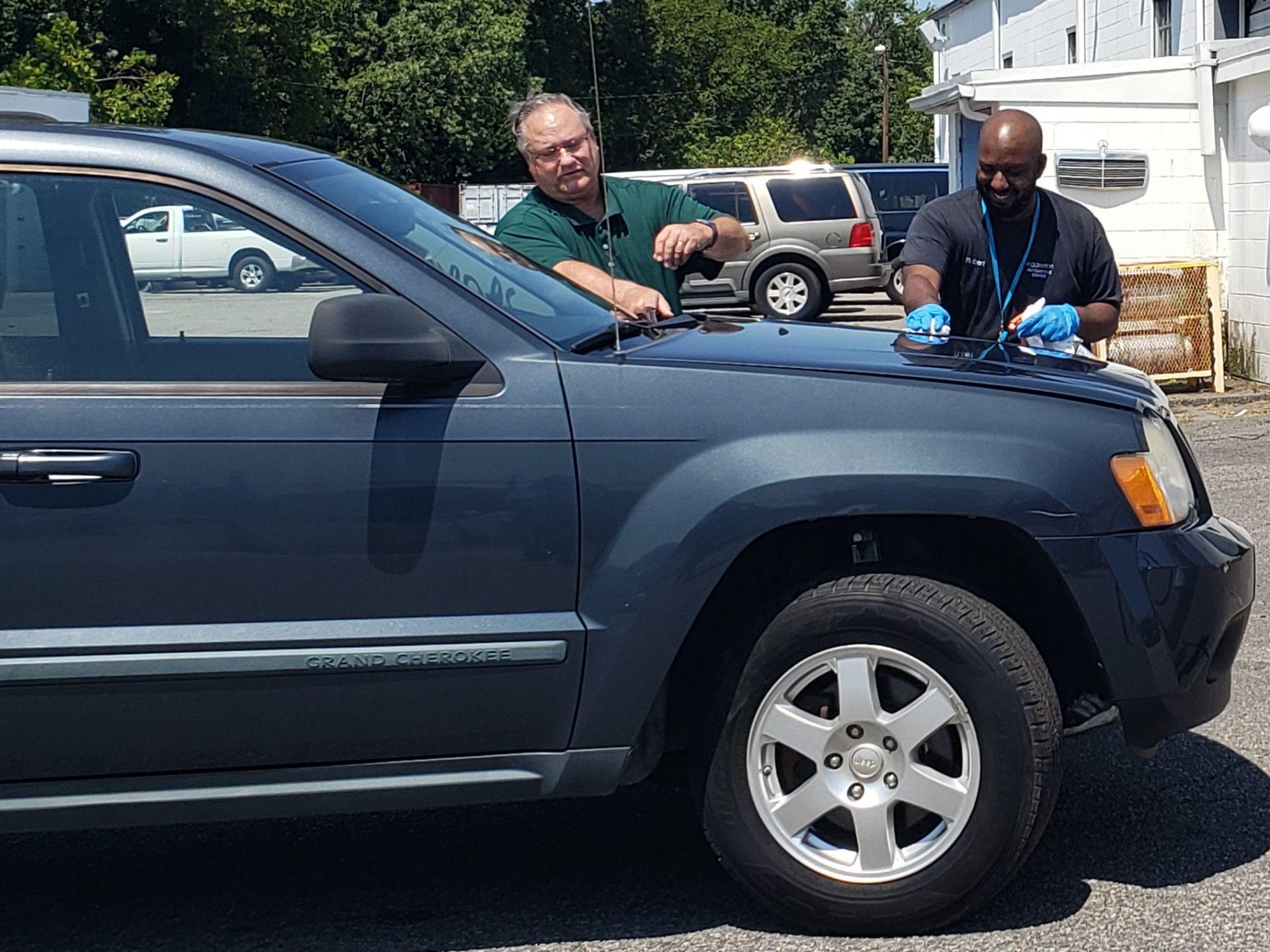 Eggleston Automotive team members working on a donated vehicle